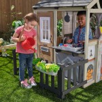 Casuta de joaca Cuptorul cu Lemne Kidkraft Cozy Hearth - Casa cu LEDuri pentru copii cu pridvor si bancute cu bucatarie si accesorii Cabin PlayHouse